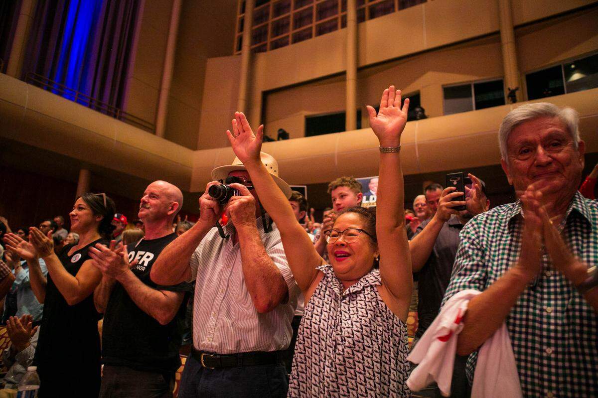 Supporters of Republican recall candidate Larry Elder cheer him on during a rally at the Paul Shaghoian Concert Hall on Sunday, Aug. 22, 2021, in Fresno, California.