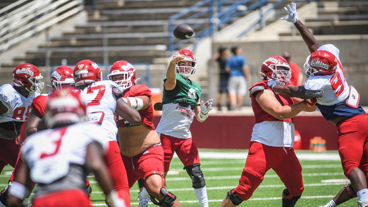 Fresno State quarterback Jake Haener throws downfield during the Bulldogs’ spring preview event Saturday, April 30, 2022, at Bulldog Stadium.
