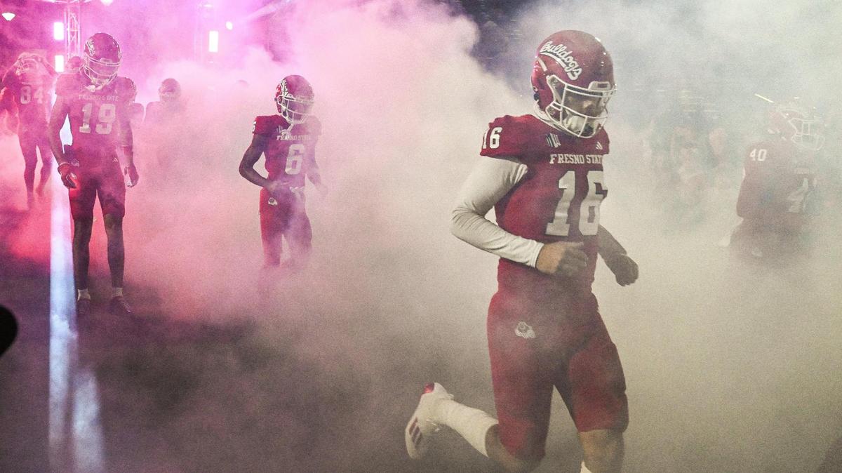 Fresno State players enter the field for their game with New Mexico at Valley Children’s Stadium last November. An opponent of Measure E, which is on the March primary ballot, questions how sales tax revenues might be used to improve the stadium.