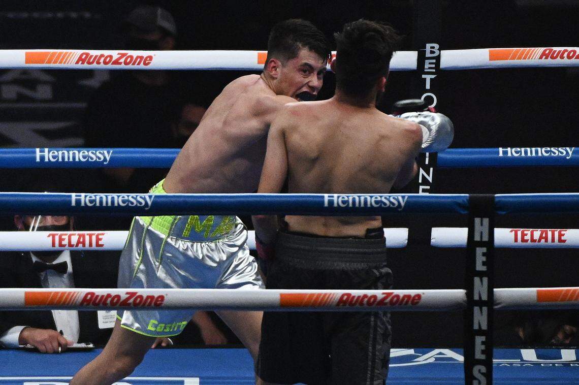Marc Castro, left, and Luis Javier Valdes during their bout at the Alamodome in San Antonio on Saturday, Dec. 19, 2020.