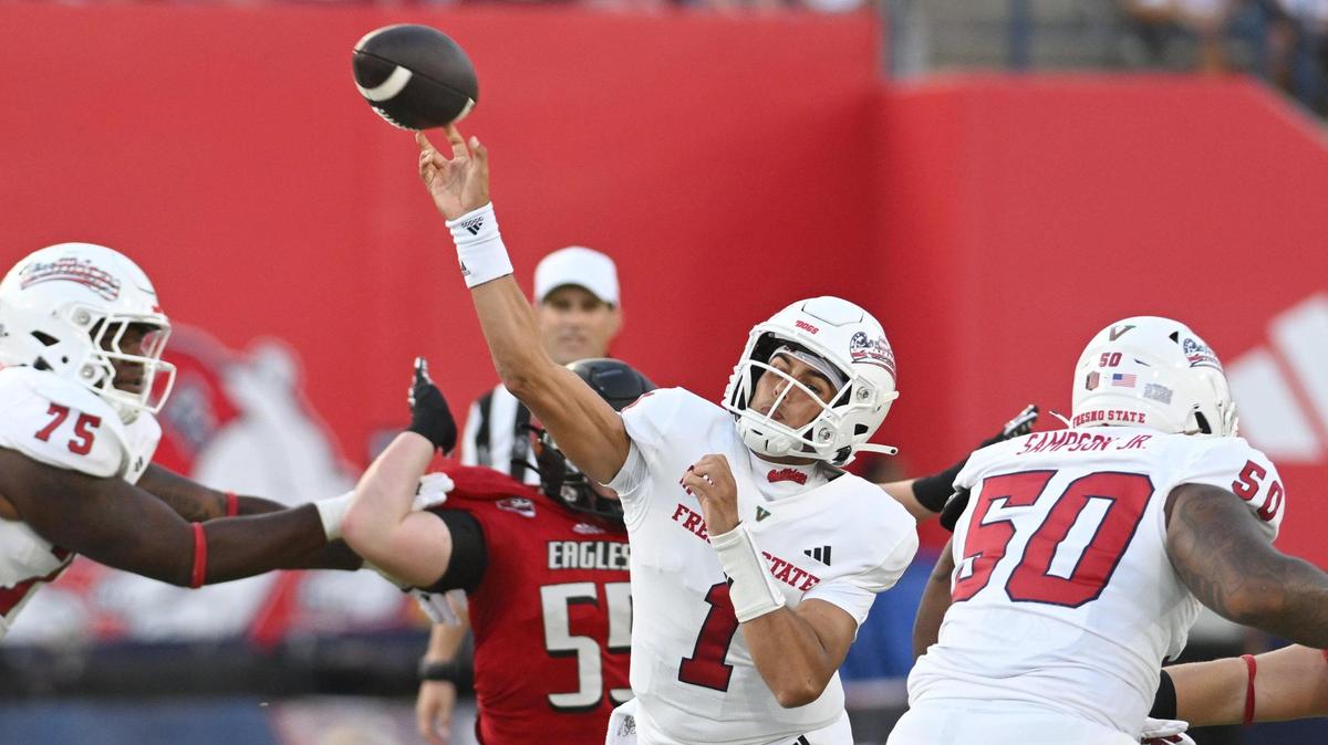 Fresno State quarterback Mikey Keene, center, throws downfield during their game against Eastern Washington at Valley Children’s Stadium on Saturday, Sept. 9, 2023.