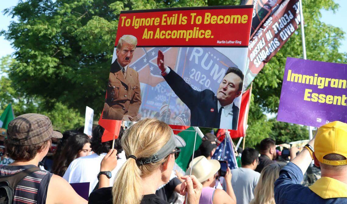 Several hundred protesters showed up on Blackstone near Alluvial in northeast Fresno to voice their opposition to various Trump administration actions on May 1, 2025.