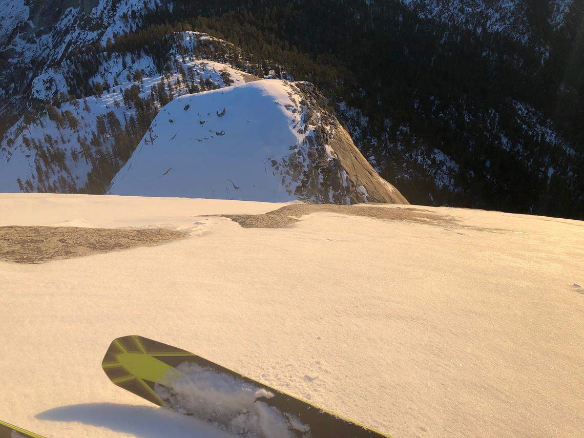 Jason Torlano looking down from atop Half Dome on Feb. 21, 2021.