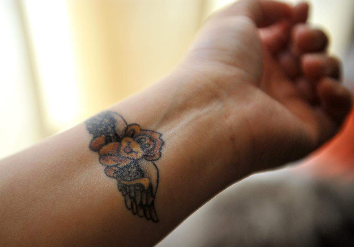 After the murder of her sister, Joanna Maya, whose nickname was “monkey,” Jannette Maya got a tattoo of a monkey with wings. Joanna was allegedly killed by the MS-13 gang in Mendota, July 13, 2016,