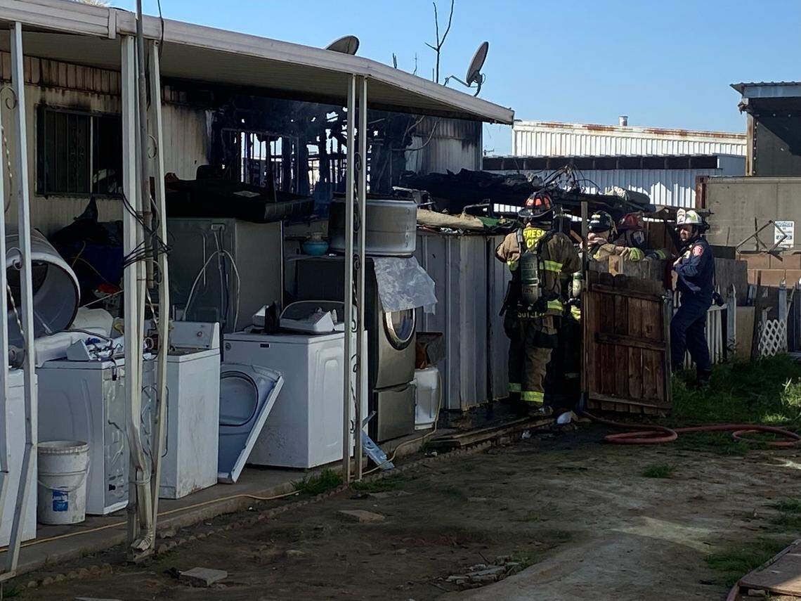 The Fresno Fire Department mops up after a blaze burned a mobile home at Four Seasons mobile home park on Thursday, Feb. 17, 2022.