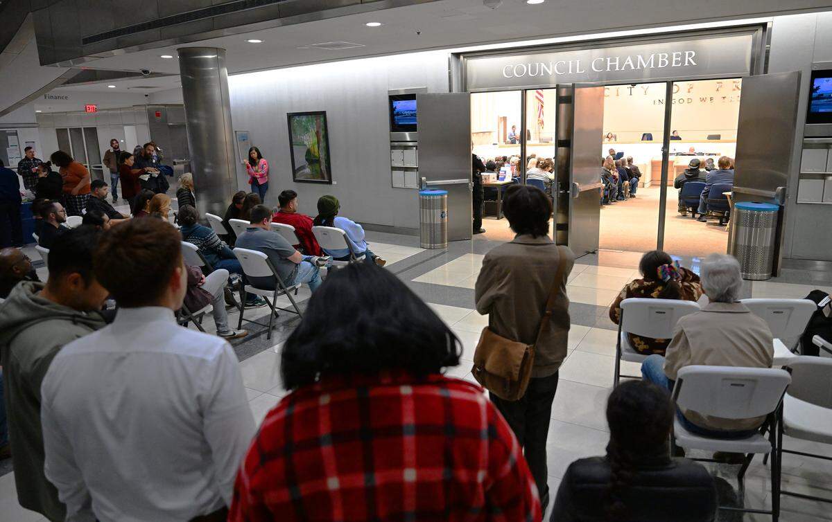 The audience overflows into the lobby outside the Fresno City Council Chambers for a public meeting about the Southeast Development Area (SEDA) plan Thursday evening, Dec. 18, 2025 in Fresno.