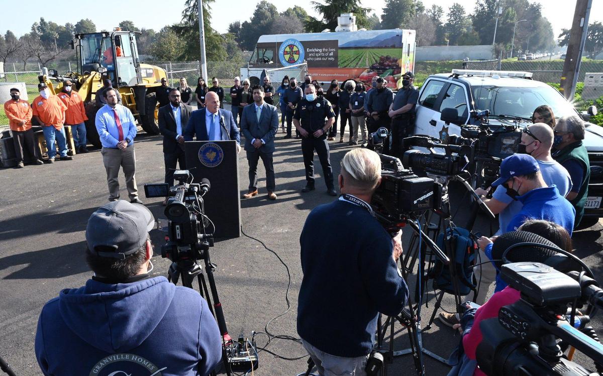 Standing at the lecturn, center, Fresno Mayor Jerry Dyer announces increased help for the unhoused through Homeless Assistance Response Team (HART) during a press conference Tuesday, Jan. 25, 2022 in Fresno.
