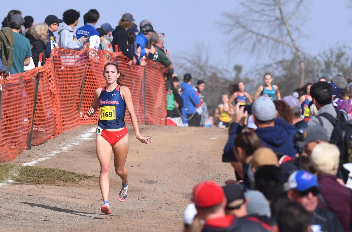Buchanan’s Grace Hutchison leads the CIF Girls D-V state cross country championship meet Saturday, Nov. 26, 2022 in Fresno.
