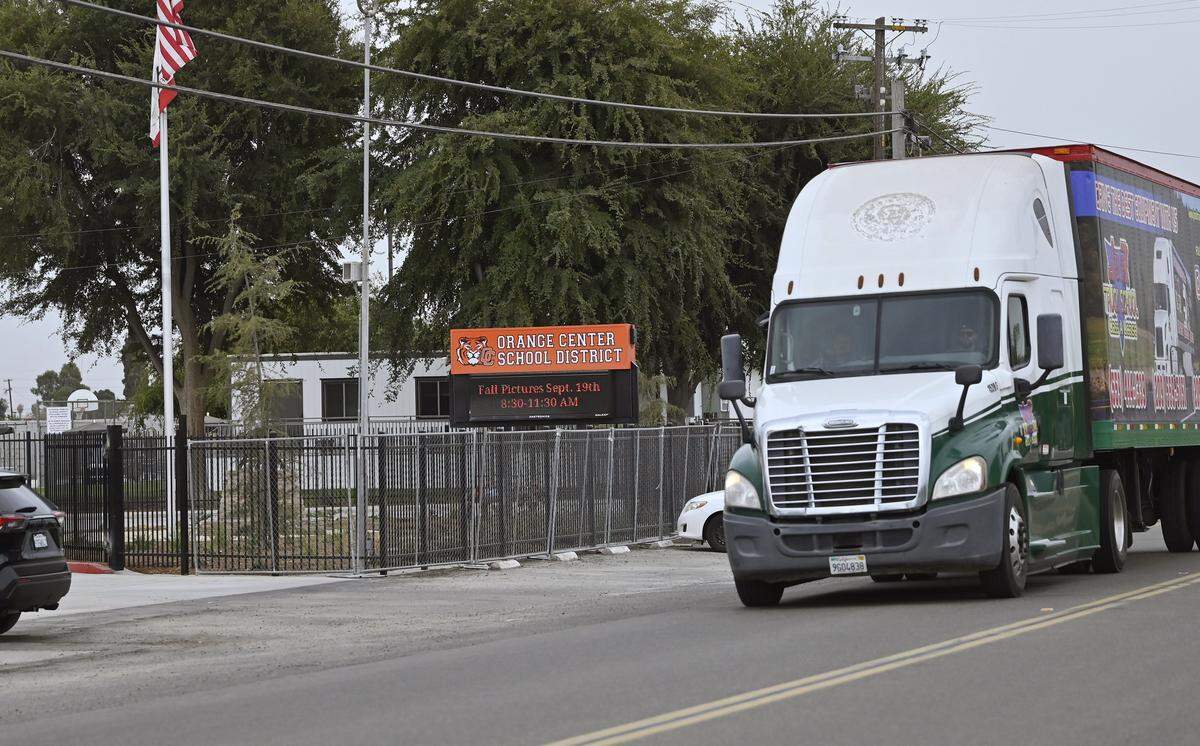 A truck passes the Orange Center School District offices along S Cherry Ave. Thursday, Sept. 18, 2025 isouth of Fresno. The Fresno City Council will decide whether to annex and rezone an area along South Cherry Avenuefor increaed trucking traffic but people residents and administrators at the Orange Center School District oppose the change. 