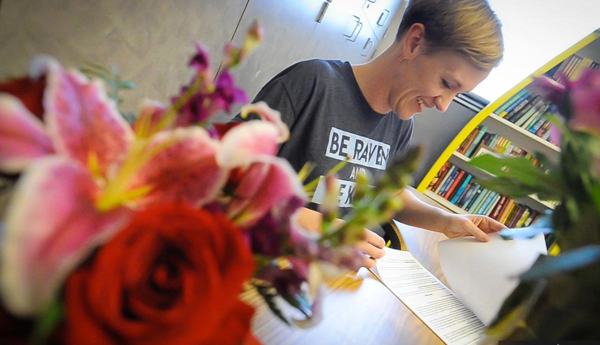 Bud Rank Elementary sixth-grade teacher Allison Vargas catches up on student’s papers at a table filled with flowers, donated by well-wishers. She is battling colon cancer and will leave the school Friday, March 28, 2019 for a leave of absence to spend more time with her 1 1/2-year-old daughter and husband.