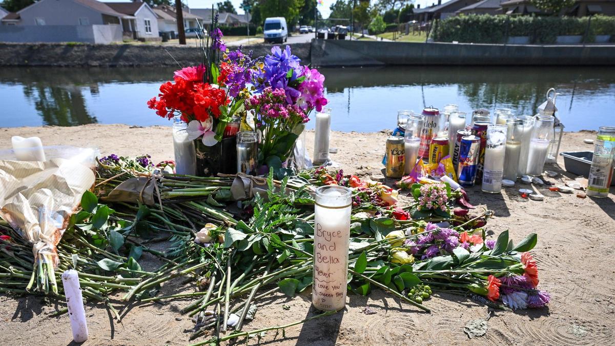 A memorial left following a vigil for a motorcycle rider killed Friday, May 2, appears on the bank of the canal at Maroa Avenue at Fedora in Fresno on Monday, May 5, 2025. The victim of the collision was 21-year-old Bryce Tomlinson of Fresno.