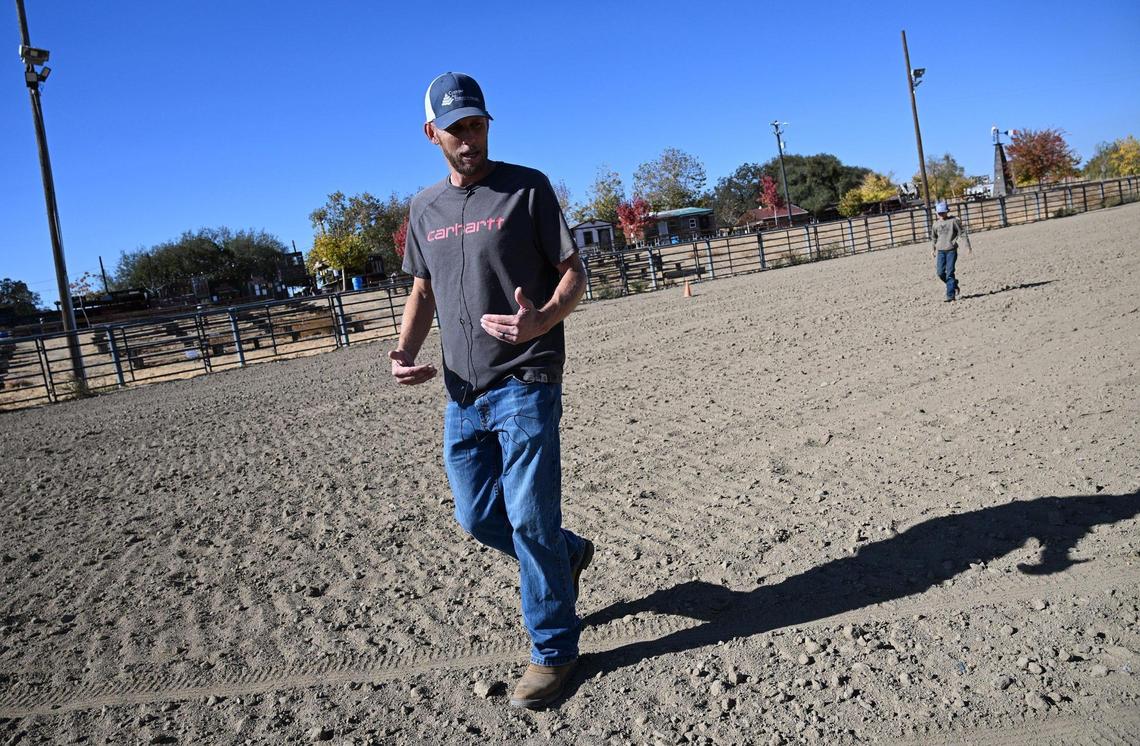 Ryan Steward, followed by his son Kaleb, 10, talks about the plans he and his wife have for rejuvenating the Coarsegold Rodeo Grounds. Photographed Friday, Nov. 8, 2024 near Coarsegold.