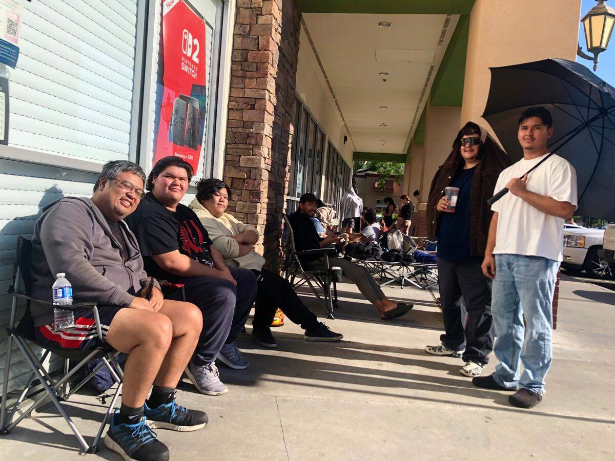 Wes Tugade (far left) camped overnight outside of a GameStop in Clovis to buy a pair of Prismatic Evolutions Elite Trainer Boxes that comprised a total of 18 packs of cards. The line wrapped around the building, at least 45 people deep. In all, Tugade waited roughly 12 hours for the opportunity to buy Pokemon cards. “You either wait or you pay market price,” Tugade said.