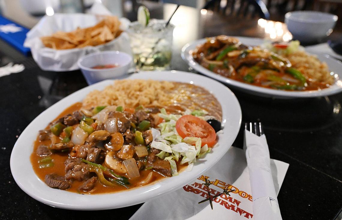 Pepper steak, bottom, paired with chips, a margarita and a wet burrito, top right, is seen at the new Toledo’s Mexican Restaurant, newly opened at Cedar and Nees avenues. Photographed Tuesday, April 22, 2025 in Fresno.