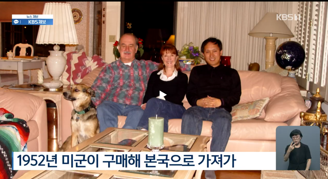 Screenshot of a photo featured in a news story by the Korean Broadcasting System of Pat Patterson, left, with his wife, Kris Patterson, center, and Byungmo Chung during his visit to their Clovis home in 2007.
