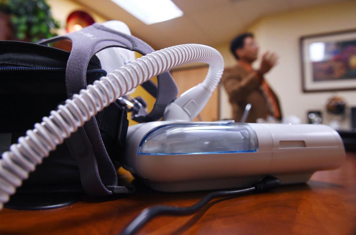 Marek Warzawski’s CPAP machine, left, with Dr. Arnold Rugama, M.D. of Fresno Sleep Specialists, Inc. in the background Thursday, June 27, 2019 in Fresno.