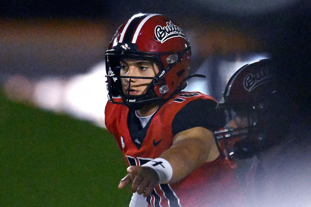 Hanford quarterback Daniel Gomez signals before a lay against Tulare Union Friday, Oct. 11, 2024 in Hanford. Final score, Hanford 33, Tulare Union 8.