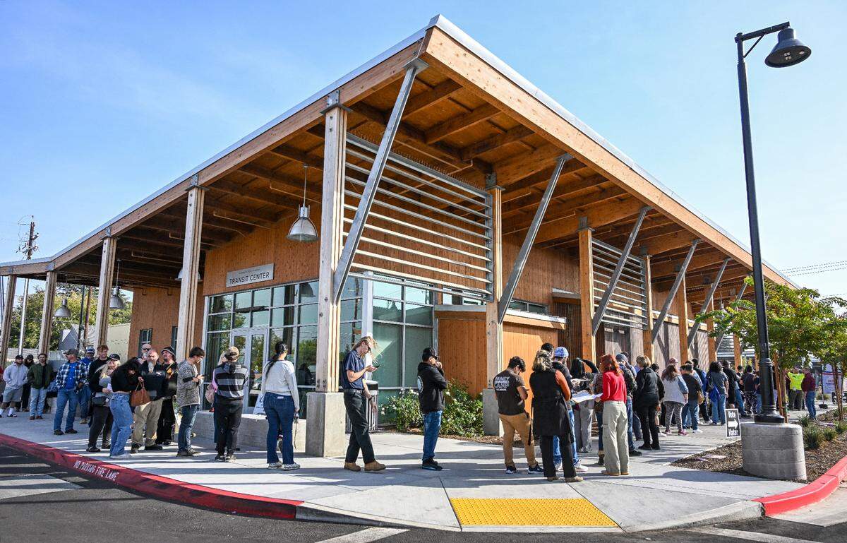 Voters wait in a line that wraps around the building at the Clovis Transit Center, a new permanent polling place that replaces its former location at Clovis City Hall, on Election Day, Tuesday, Nov. 5, 2024. Voters and polling officials were saying the wait to vote was taking about two hours.