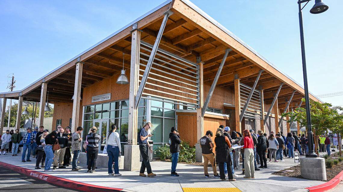 Voters wait in a line that wraps around the building at the Clovis Transit Center, a new permanent polling place that replaces its former location at Clovis City Hall, on Election Day, Tuesday, Nov. 5, 2024. Voters and polling officials were saying the wait to vote was taking about two hours.