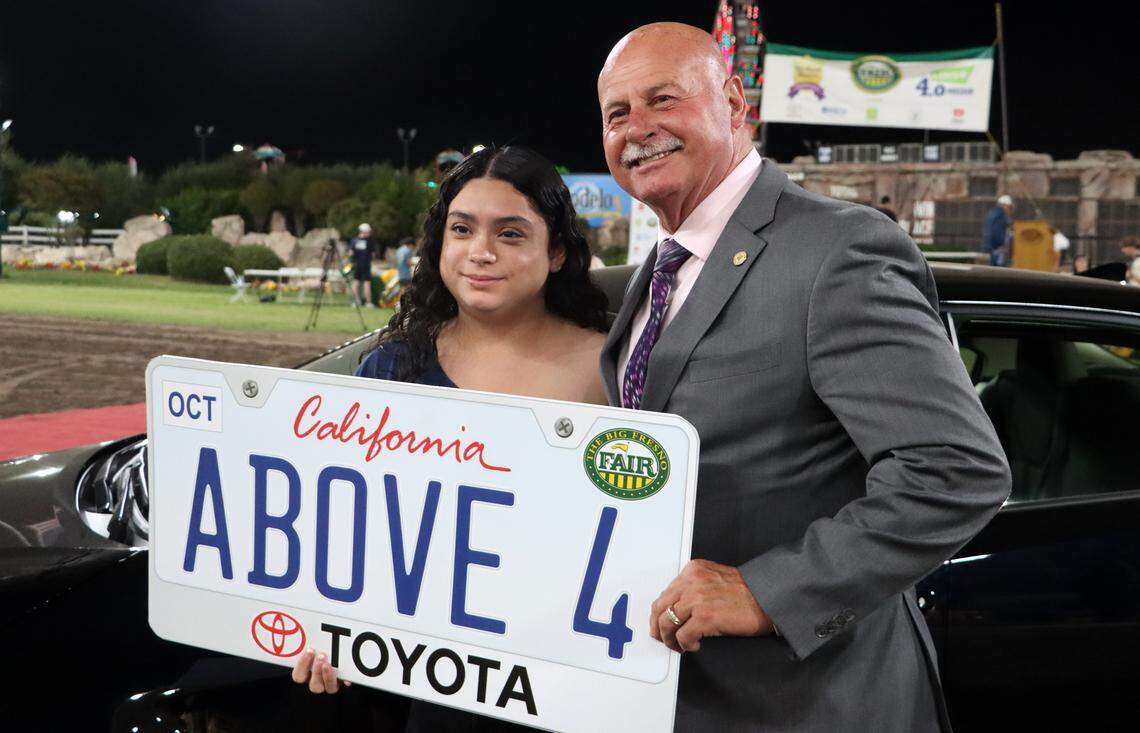 Sunnyside High School senior Mía Salcedo poses with Fresno Mayor Jerry Dyer after winning a 2025 Toyota Corolla during The Big Fresno Fair's 4.0 and Above program on Sept. 29, 2025.