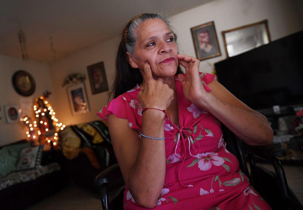 Maria Enriquez talks about the cloudy water she has endured from her home’s tap water Wednesday afternoon, Aug. 12, 2020 in Fairmead. The water wells of Fairmead, many of them privately owned, are drying up. The County of Madera plans to build a new well, but it may not be finished until 2021.
