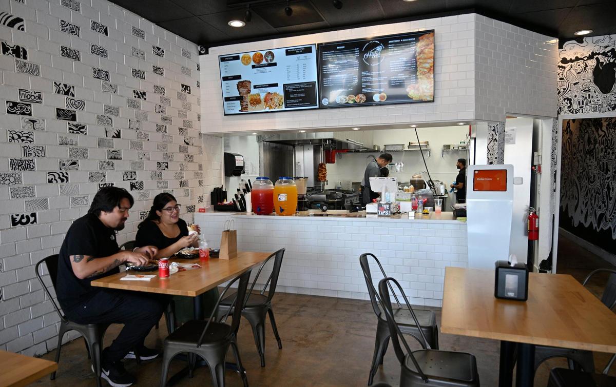 Customers enjoy lunch at Halal Bros across from Fresno State at Cedar and Barstow avenues. The new restaurant offers a unique mix of Afghan and Mediterranean food. Photographed Monday, 2023 in Fresno.