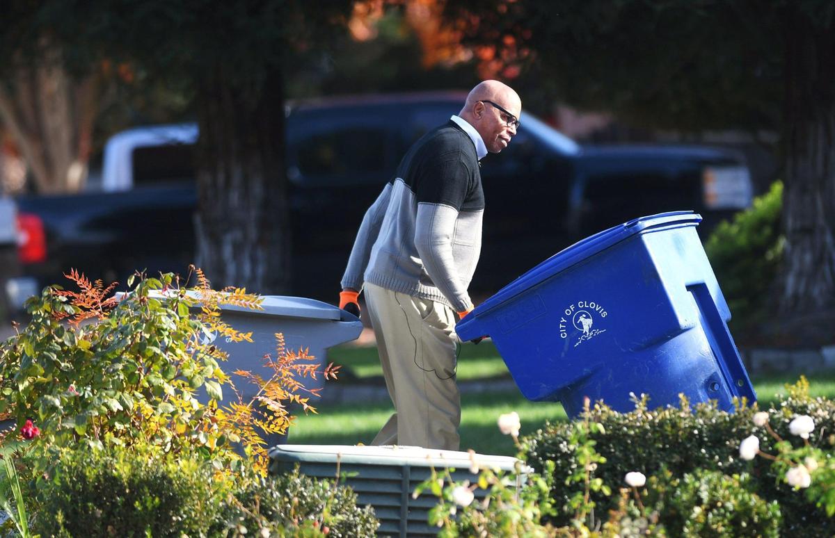 Michael Carter commits a Random Act of Kindness as he regularly pulls away his neighbors’ trash cans from the curb each Monday. Photographed Monday, Nov. 21, 2022 in Clovis.