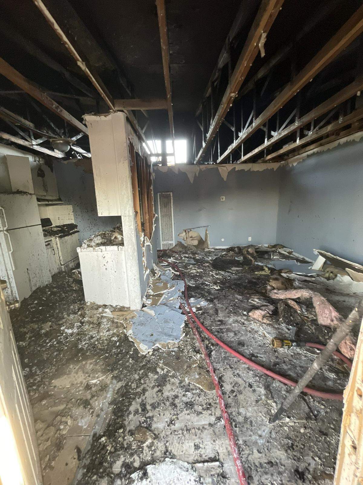 The Fresno Fire Department battles an apartment fire that spread to an attic on Sunday, April 30, 2023. Nineteen people were displaced.