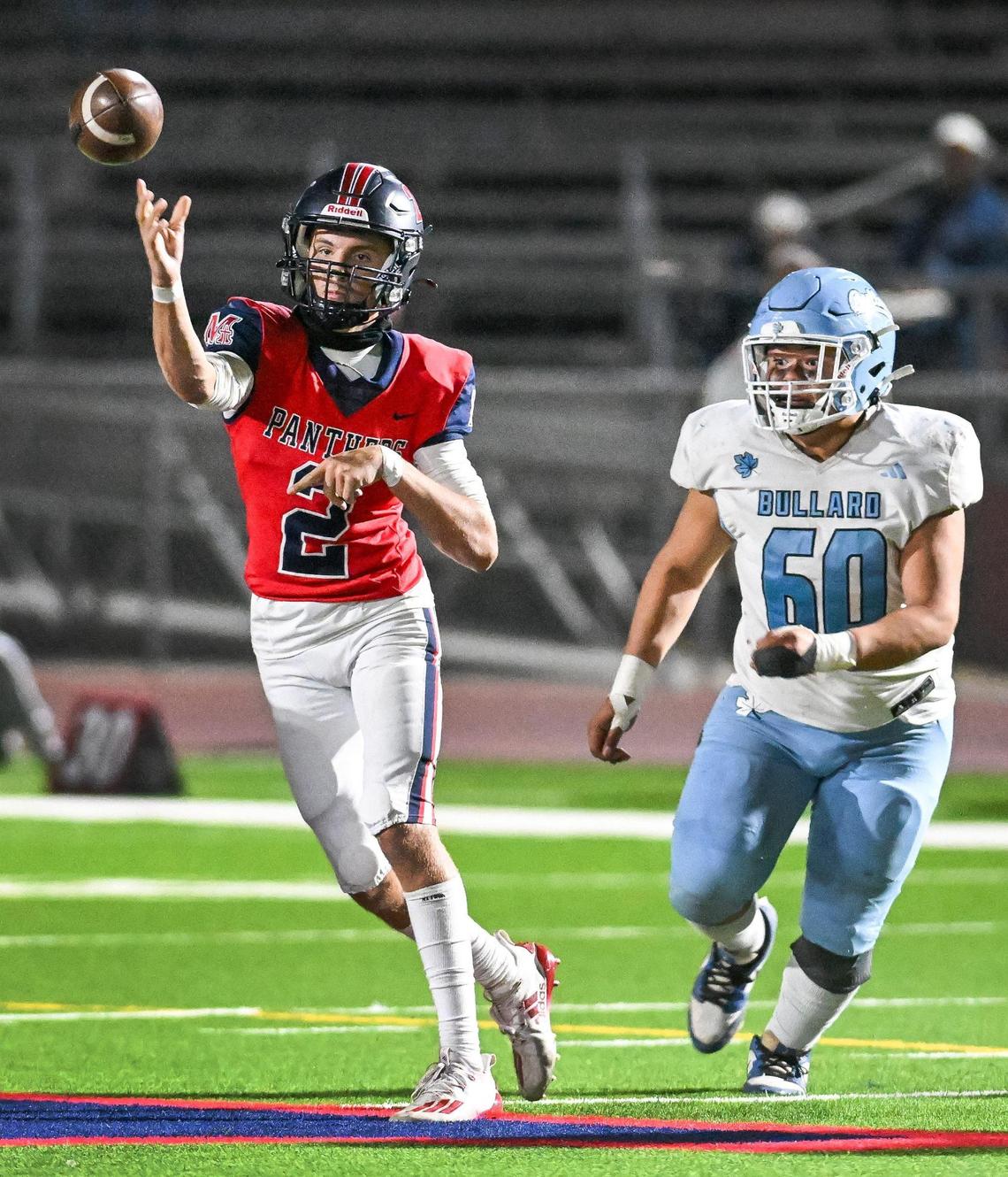 Memorial quarterback Colton Johnson throws under pressure from Bullard’s Fernando Avila III in their game at San Joaquin Memorial on Friday, Oct. 25, 2024.
