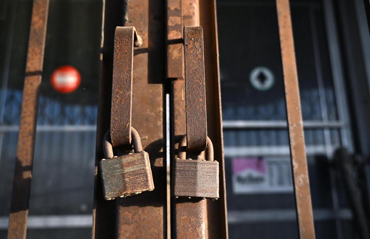 Padlocked front doors are seen at Hanoian’s Market at Butler and Cedar avenues, a landmark business which has been closed for over two decades. Photographed Friday, Oct. 18, 2024 in southeast Fresno.