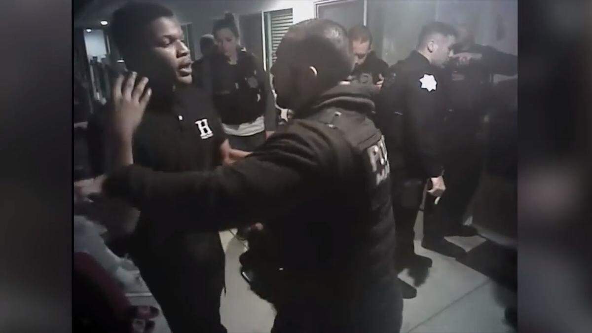A still image from a Fresno police officer body camera captures the beginning of the confrontation between Officer Christopher Martinez, right, and 17-year-old London Wallace, left, on Jan. 23 on the second floor of the Fenix Apartments near downtown Fresno.
