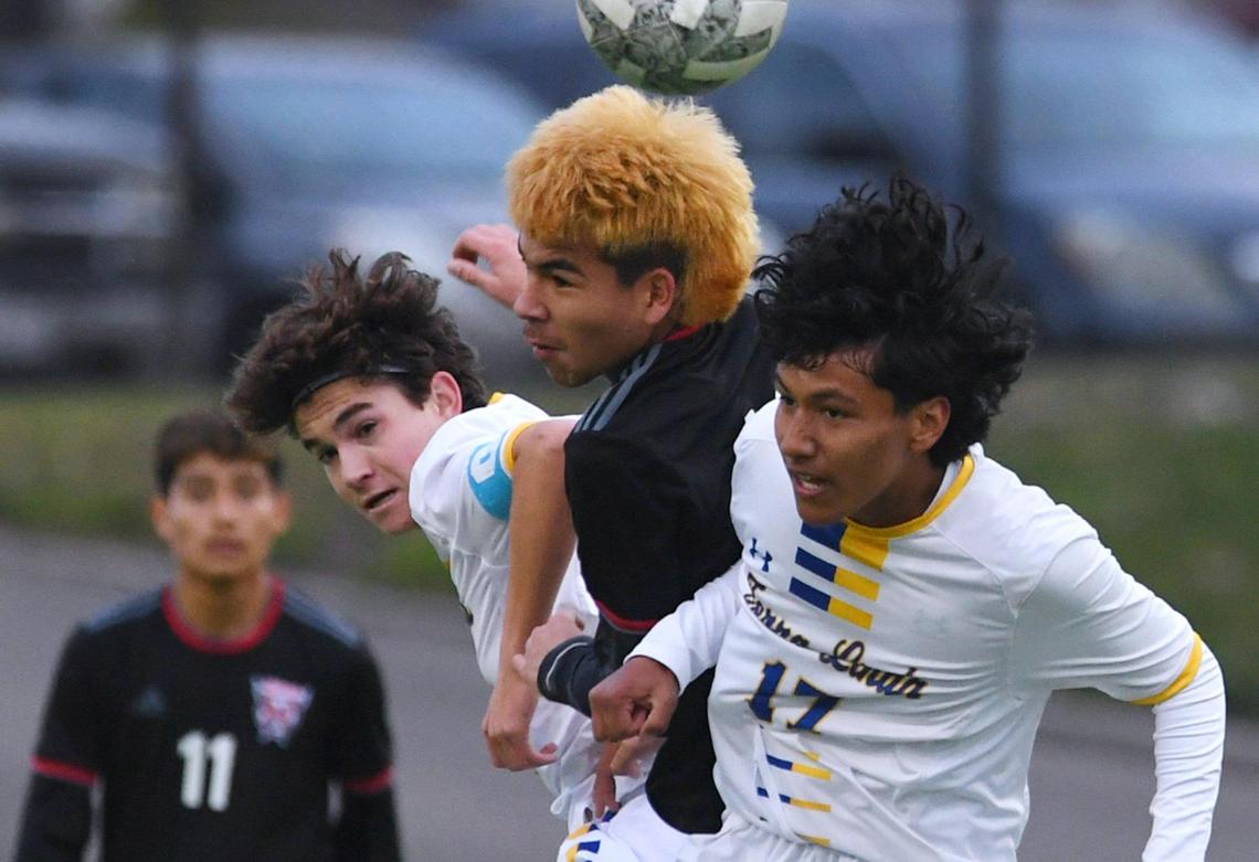 McLane’s Angel Mejia, center, with Terra Linda’s Roan Goertz, left, and Alejandro Gonzalez, rght, in the CIF Northern California Regional Division III boys soccer championship Saturday, March 4, 2023 in Fresno. Terra Linda won the championship, 2-0.