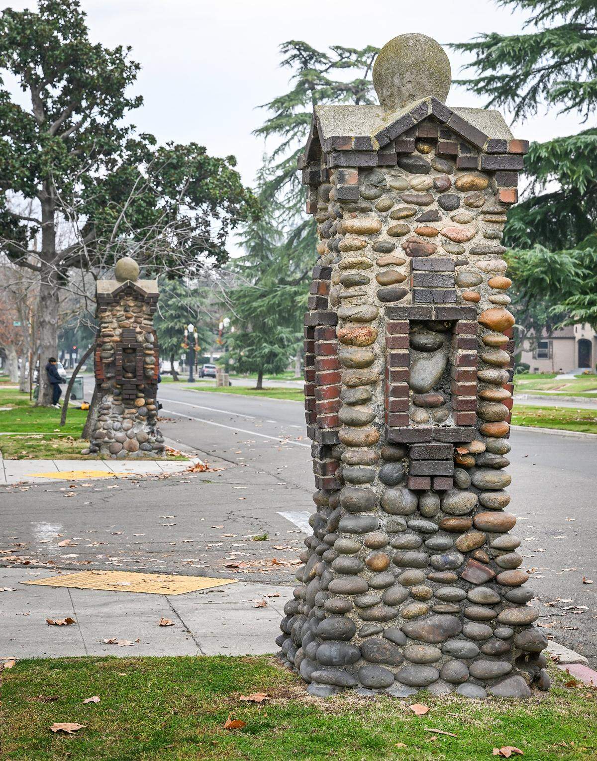 Two Fresno High neighborhood stone pillars stand at Michigan Avenue at Van Ness Boulevard on Tuesday, Dec. 30, 2025. 
