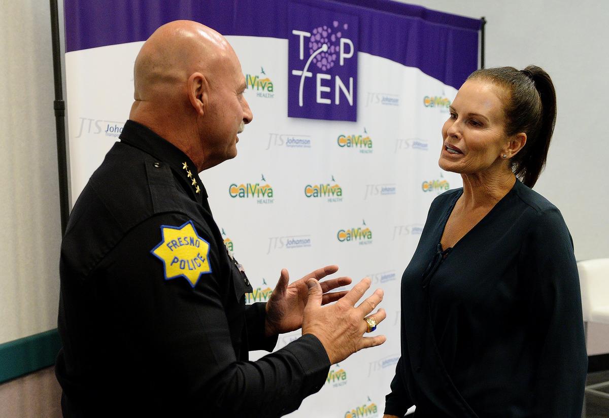 Fresno Police Chief Jerry Dyer speaks with Denise Brown, sister of the late Nicole Brown Simpson, before the start of the Marjaree Mason Center’s 35th Annual Top 10 Professional Women and Leading Business Awards at the Fresno Convention Center on Thursday, Oct. 11, 2018. Brown, who works to educate people about domestic violence, was the keynote speaker for the event.
