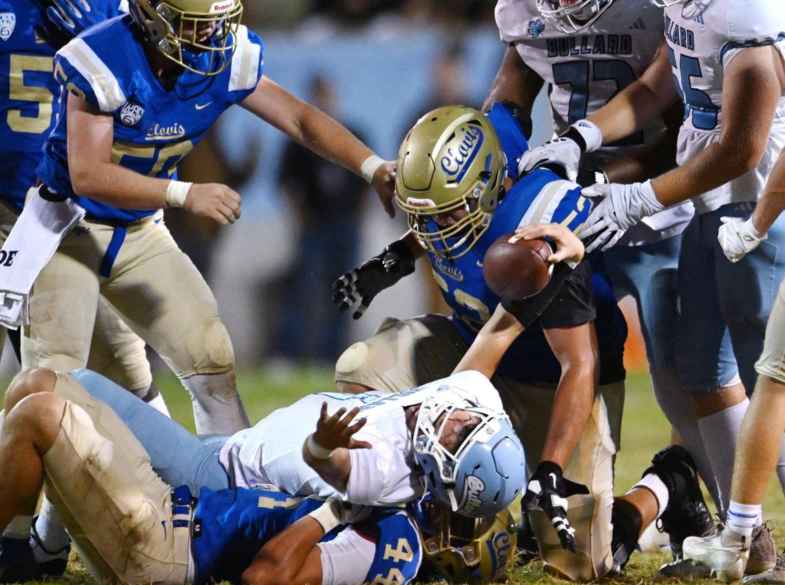 Bullard quaterback Tyler Franklin is seen sacked, bottom center, by Clovis High’s defense Friday night, Sept. 20, 2024 at Lamonica Stadium in Clovis.