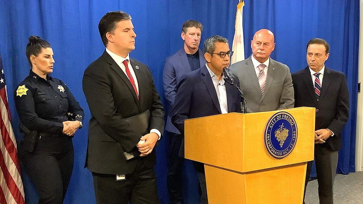 Fresno City Councilmember Miguel Arias discusses the city’s new homeless camping law that took effect Sept. 23, 2024, as interim Police Chief Mindy Casto, Councilmember Tyler Maxwell, Fresno Mission CEO Matt Dildine, Mayor Jerry Dyer and Councilmember Garry Bredefeld look on at Fresno City Hall.