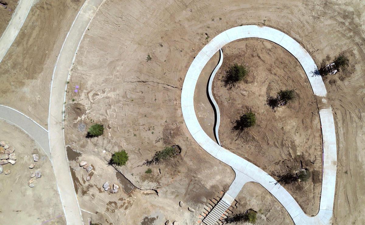 The top of the central hill, right, is seen at West Creek Village, a 10-acre park under development along South Martin Luther King Jr. Blvd just south of Church Ave. in west Fresno. Photographed Friday, June 27, 2025.
