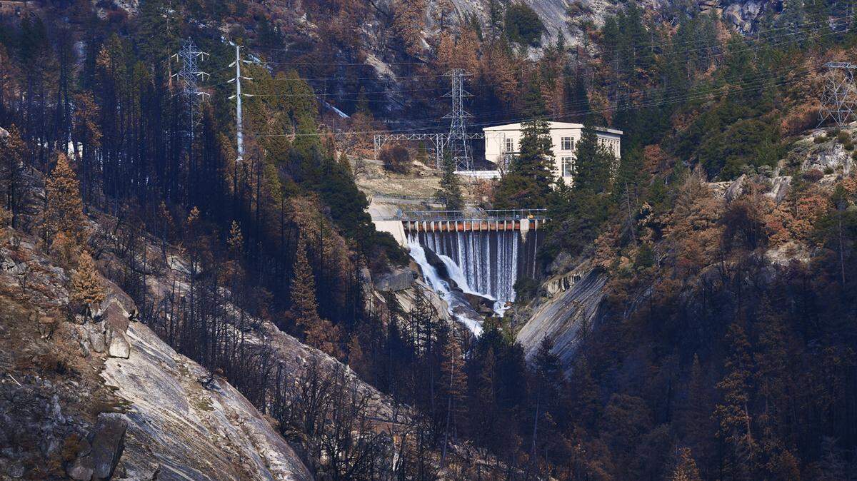 The Big Creek power plant, part of the Big Creek Hydroelectric Project, sits near the origin site of the Creek Fire as water flows downstream Wednesday, Feb. 24, 2021, near Big Creek.