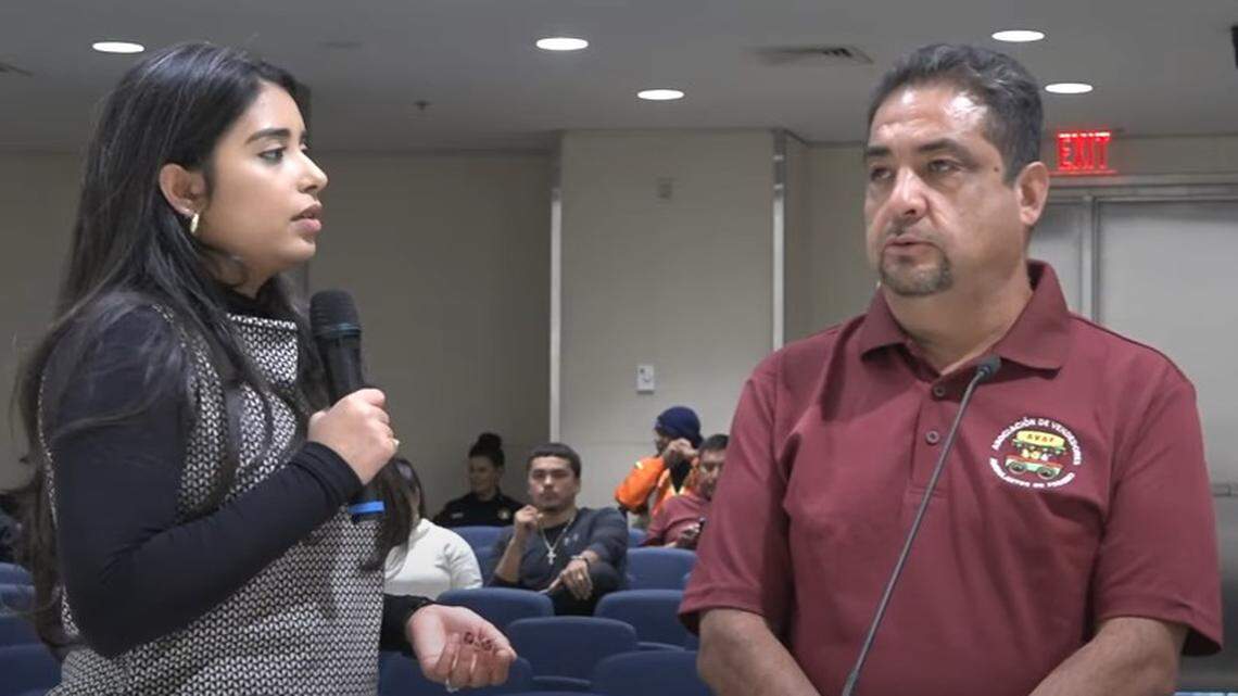 Miguel Ruiz, right, vice president of the Fresno Association of Mobile Vendors, addresses the Fresno City Council in Spanish on Thursday, Nov. 21, 2024 while a Spanish/English-language translator listens. Ruiz was among about a dozen street-food vendors and advocates urging the council to vote against a street-vendor law establishing regulations and fines for violations.