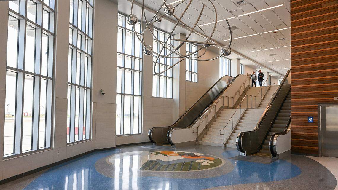 An aerial art sculpture and floor tile display art at the entrance to the new Concourse B at Fresno Yosemite International Airport.