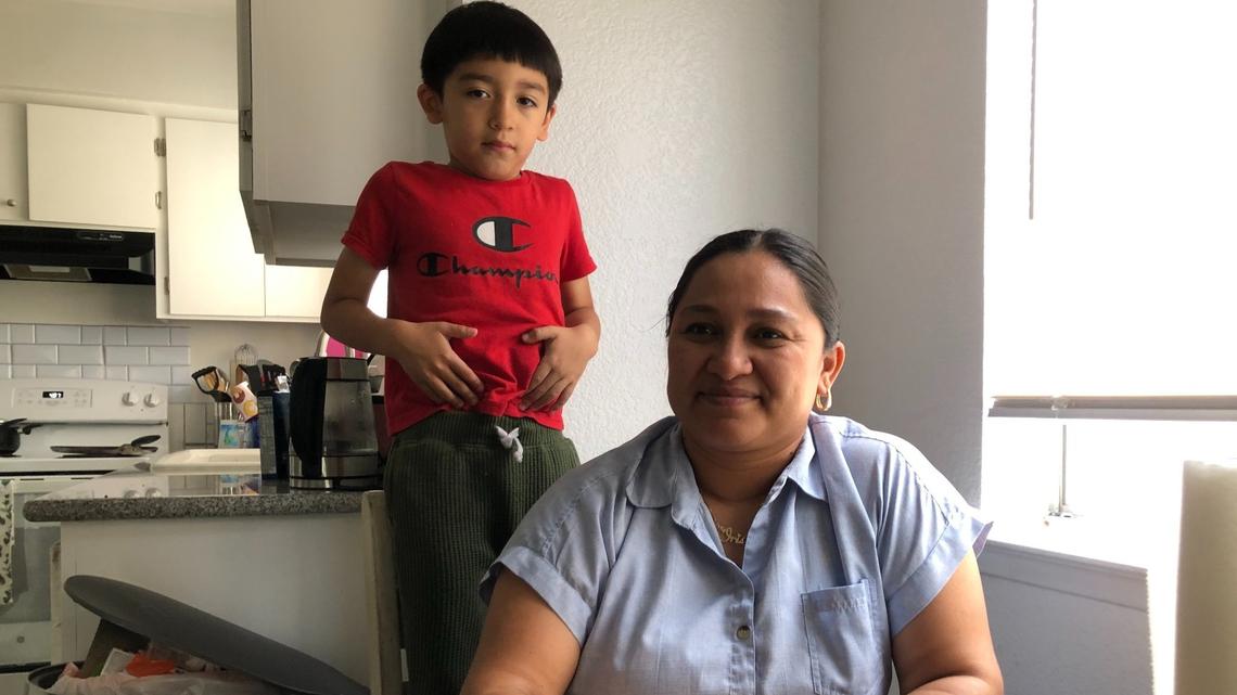 Juana Iris Meza, poses for a photo in the kitchen on her Fresno home with her son, Ryan, on Tuesday, June 27, 2023. Meza is considered a cost burdened renter, paying more thatn 30% of her income on rent, and would like to see rent control in Fresno.