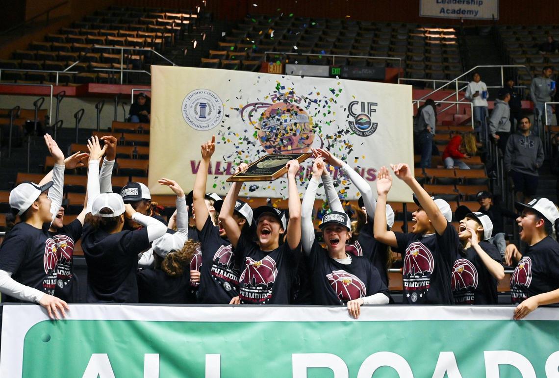 Clovis West celebrates its 54-42 win over Clovis High for the Central Section girls Division I basketball championship Saturday, Feb. 25, 2023 in Fresno.