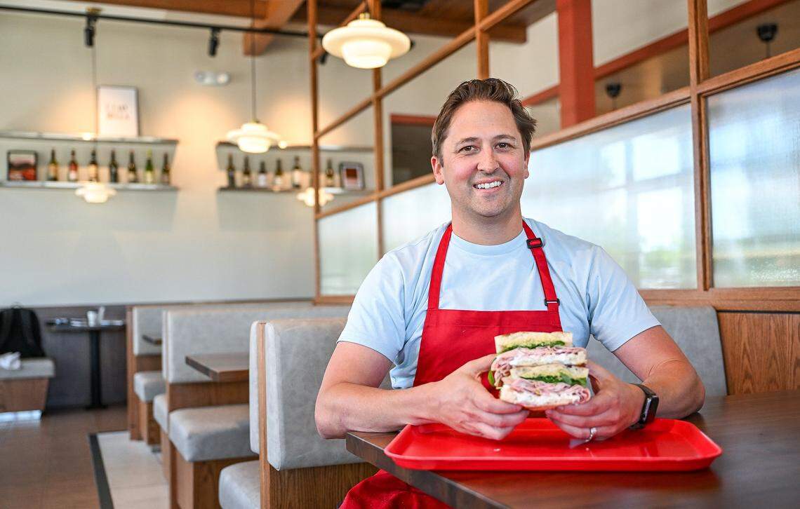 Jimmy Pardini sits with a mortadella sandwich at his new restaurant, Strada, an Italian-inspired sandwich shop opening next to one of his other restaurants, Annesso Pizzeria, in the Park Crossing shopping center at Friant Road and Audubon Drive.