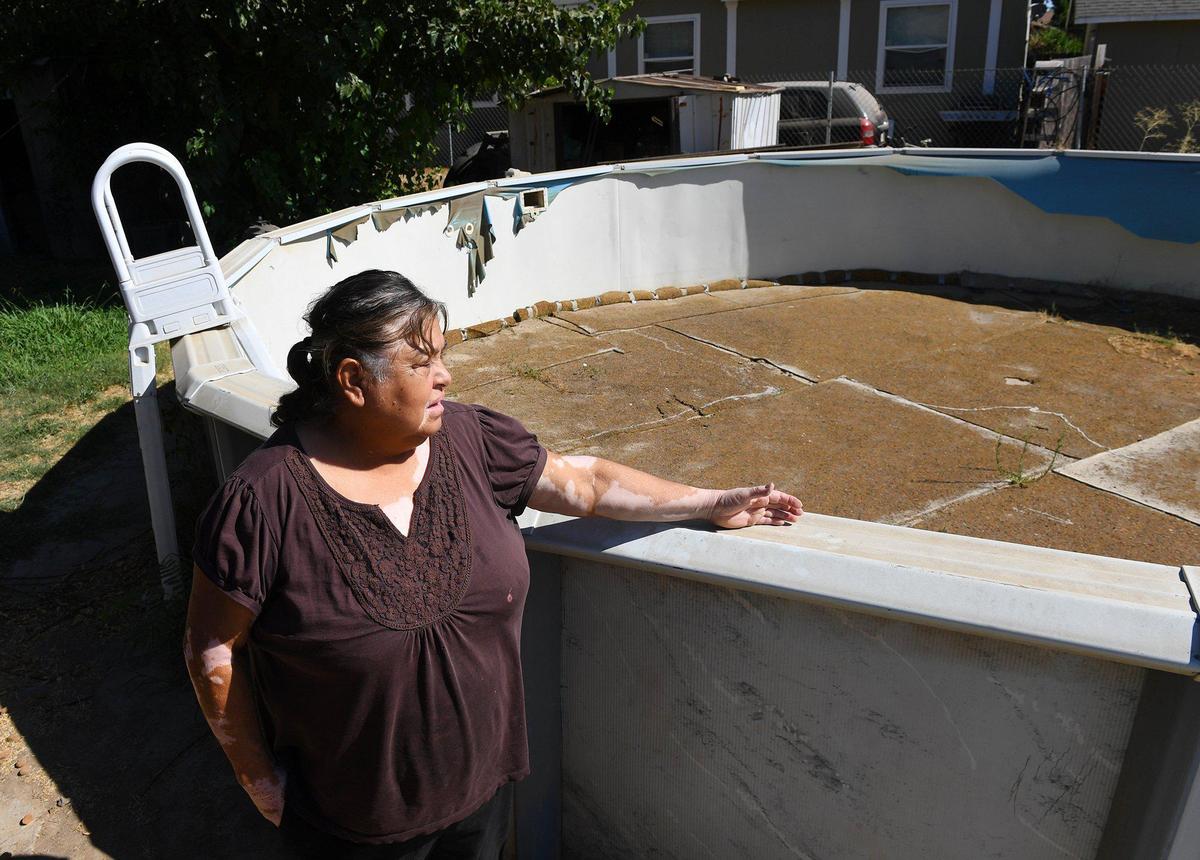 Norma Bustillos doesn’t keep water in the family’s backyard pool. Photographed Wednesday afternoon, Aug. 12, 2020 in Fairmead.