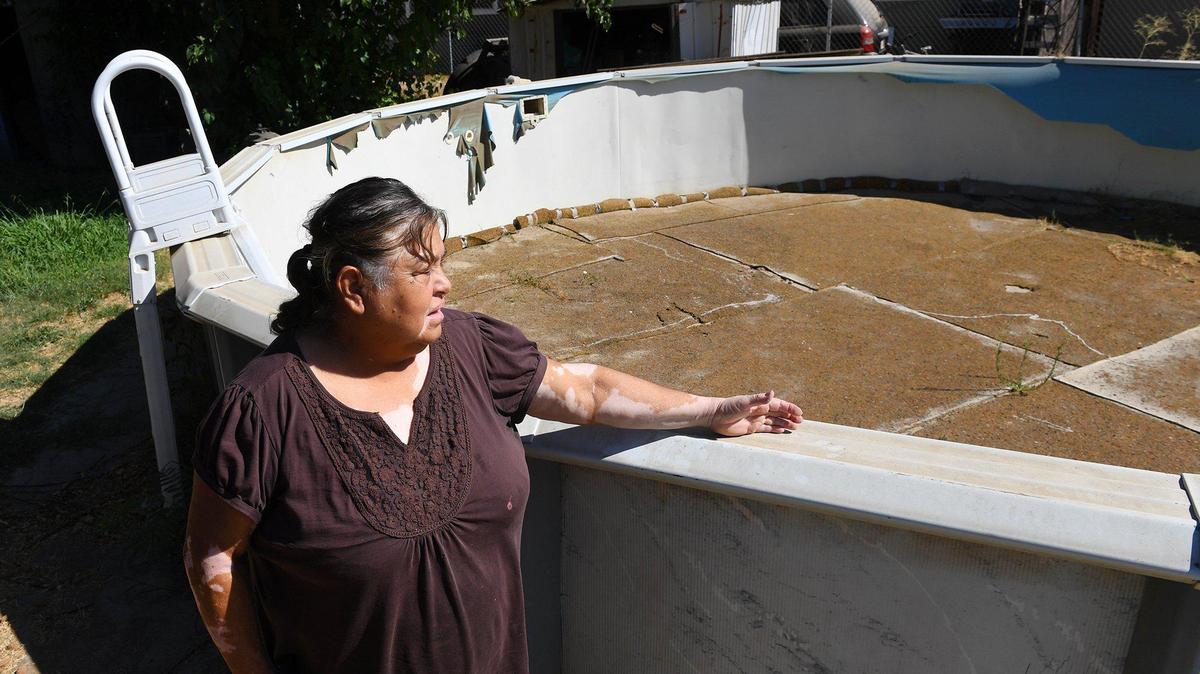 Norma Bustillos doesn’t keep water in the family’s backyard pool. Photographed Wednesday afternoon, Aug. 12, 2020 in Fairmead.