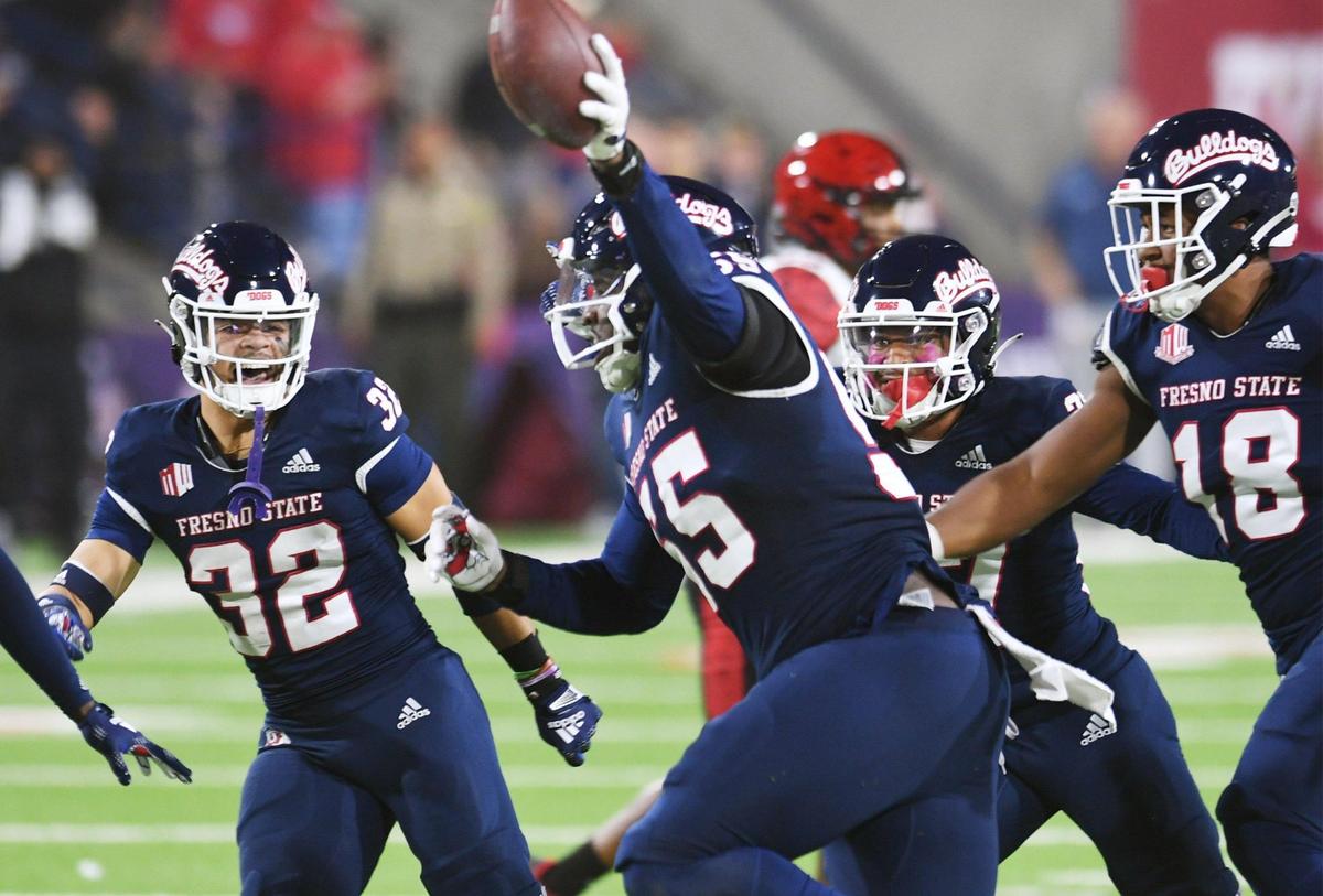 Fresno State’s Leonard Payne Jr., center, celebrates recovering a San Diego State fumble Saturday, Oct. 29, 2022 in Fresno.
