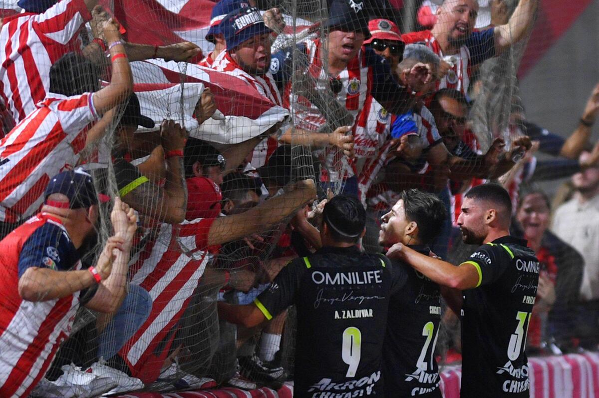 Chivas de Guadalajara fans celebrate Cristian Calderon’s goal against Pumas, center player, Wednesday, March 23, 2022 in Fresno.