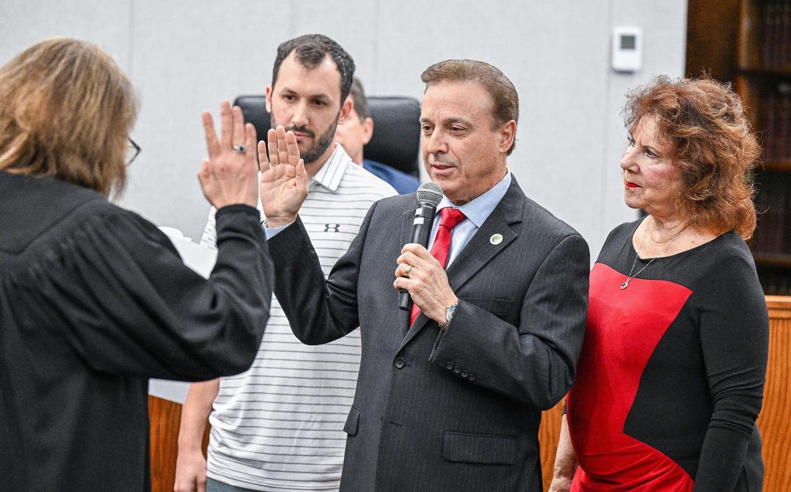 Garry Bredefeld is sworn in as District 2 supervisor with his wife and son at his side during the Fresno County Board of Supervisors meeting on Tuesday, Jan. 7, 2025.