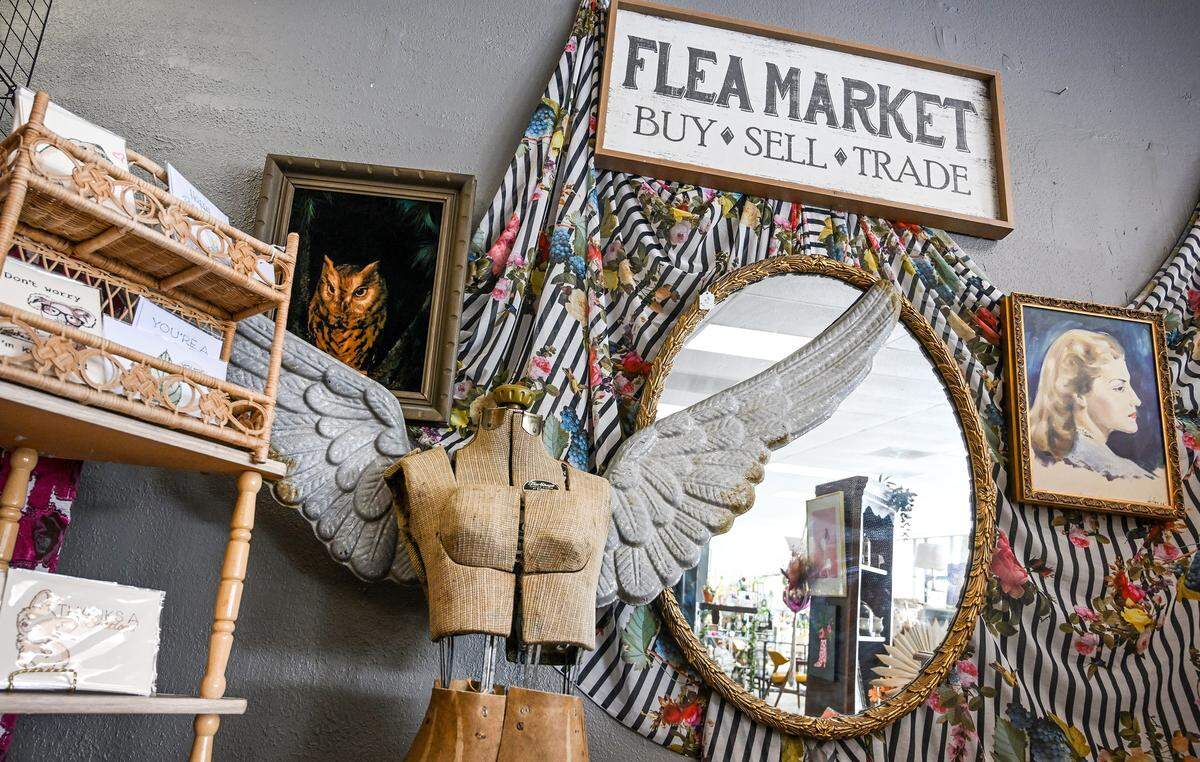 Different vintage signs, pictures, displays and even a mannequin with wings are among the various items available at Resuscitated Marketplace and Thrift boutique in Fresno.