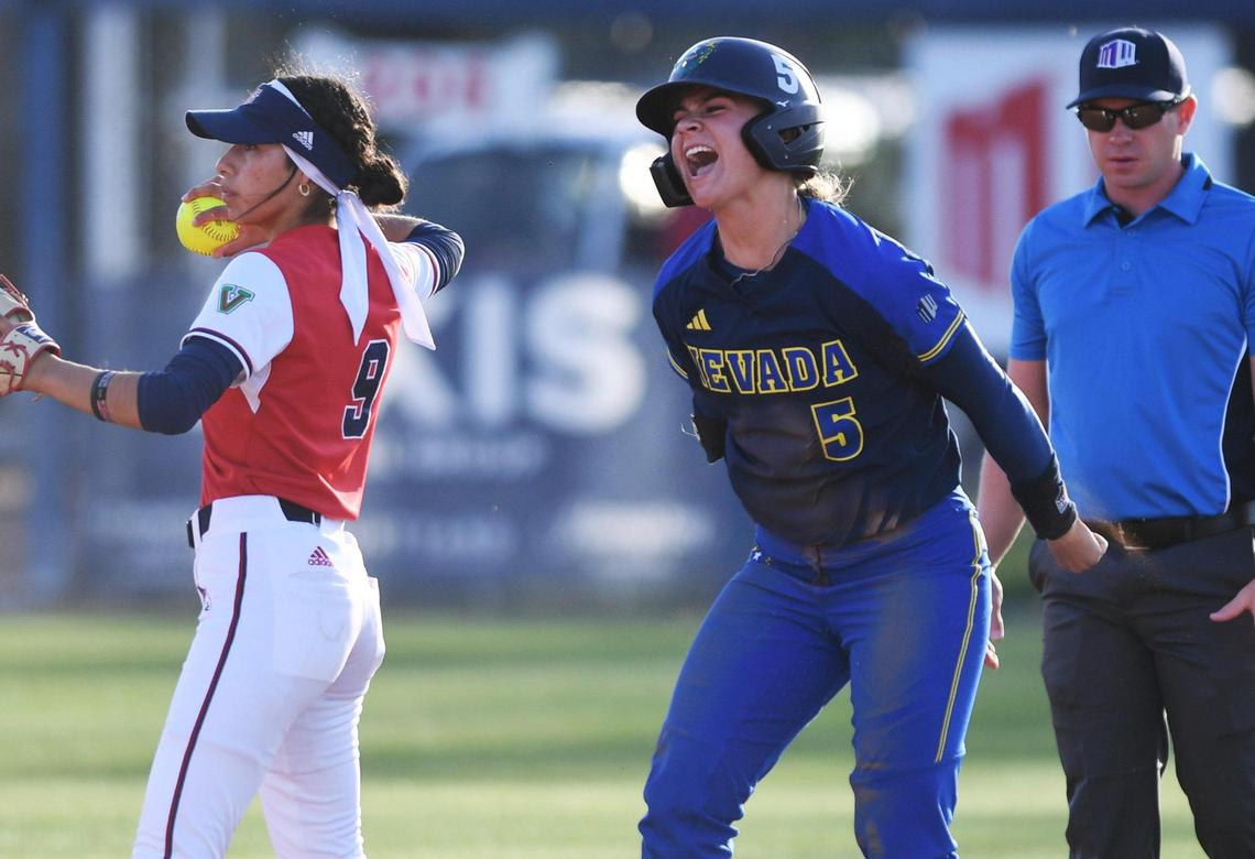 Nevada’s Gabby Herrera, right, celebrates her slide to second covered by Fresno State’s Emma Martinez, left, Friday, April 21, 2023 in Fresno.